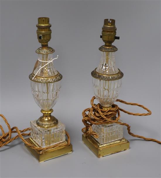 A pair of French gilt metal mounted glass table lamps